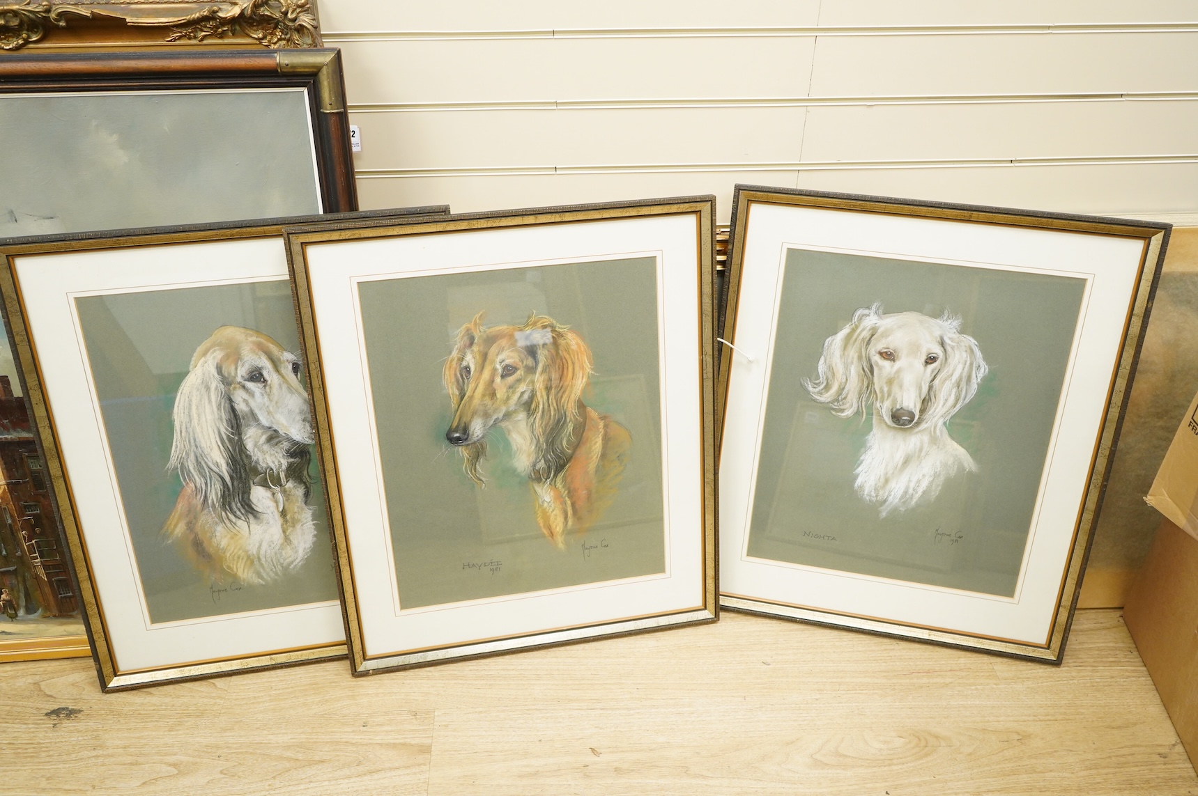 Marjorie Cox (British 1915-2003), six pastel portraits of Salukis and another of a cat, all signed and dated, largest 51 x 41cm